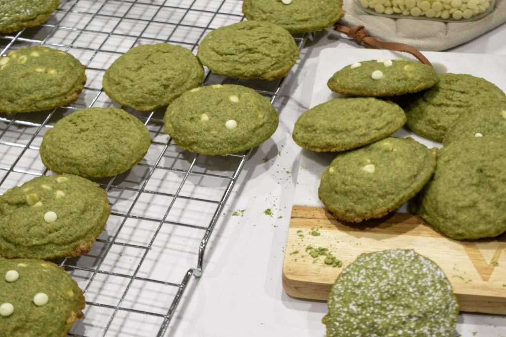 Matcha cookies with white chocolate chips and powdered sugar