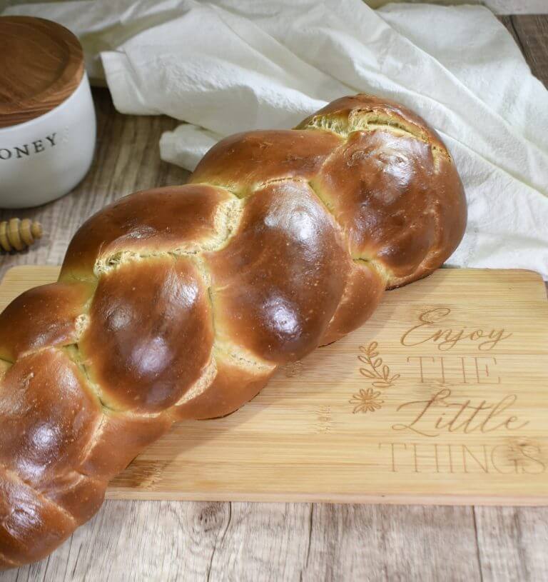 Sourdough Challah Bread on Cutting Board with Honey Jar