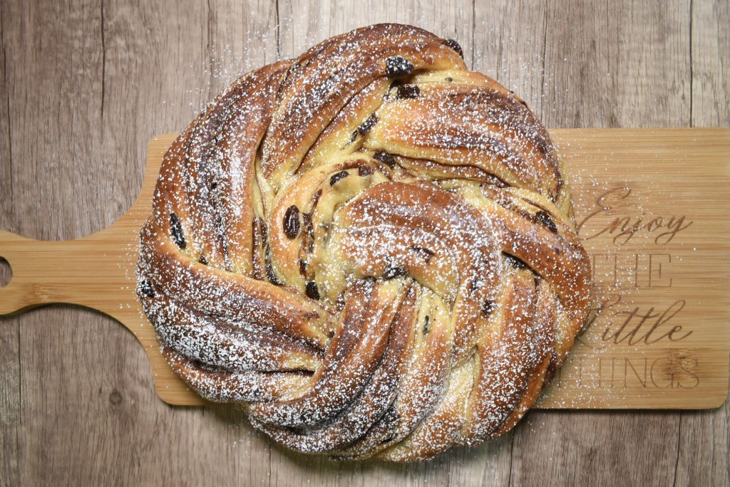 Sourdough Cinnamon raisin bread rose on cutting board
