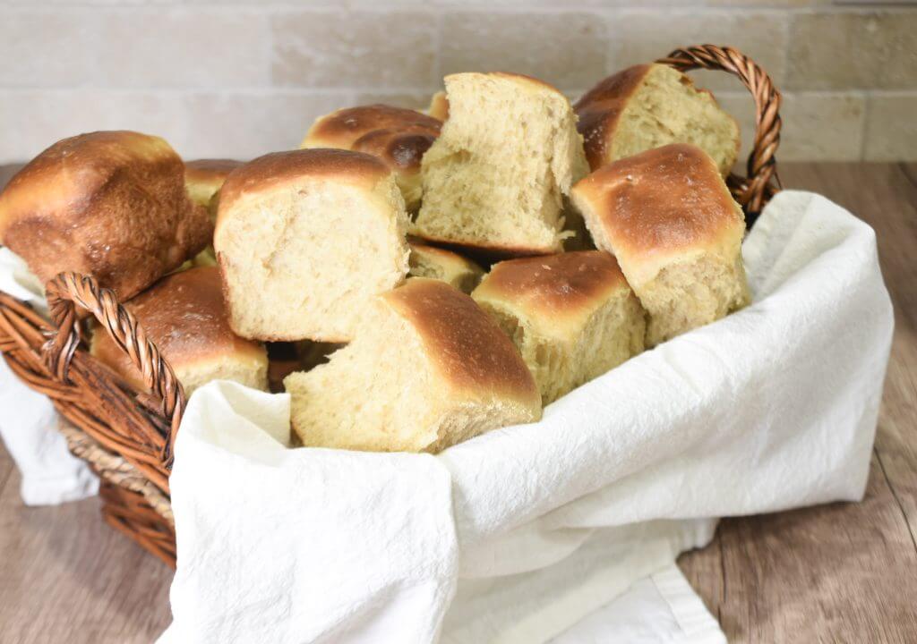 Sourdough Milk Brioche Rolls in a lined basket