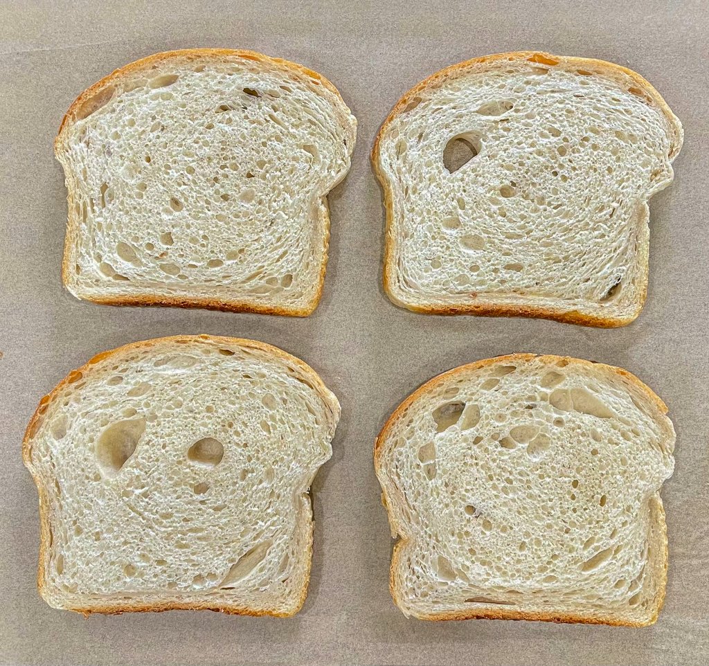 Sliced bread on parchment paper