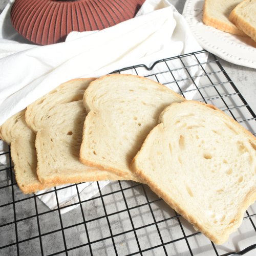 Sourdough bread slices on cooling rack